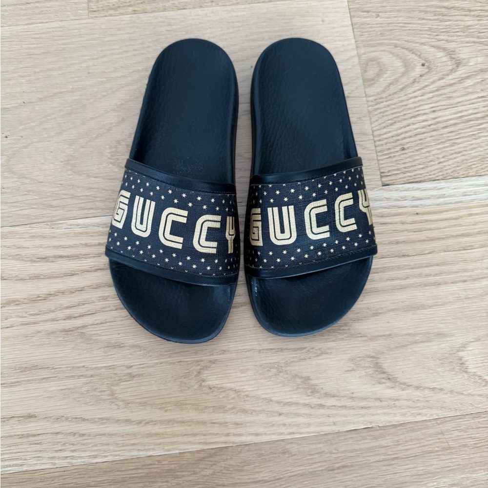 Gucci Guccy Black Slides with Gold Logo